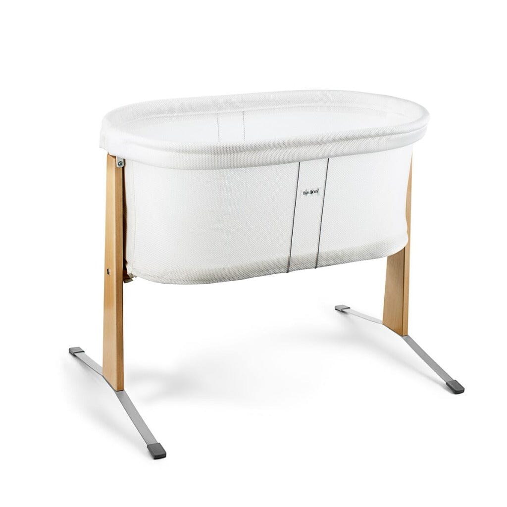 BabyBjorn Cradle bassinet in white mesh on a beech wood frame with silver feet, on a white background