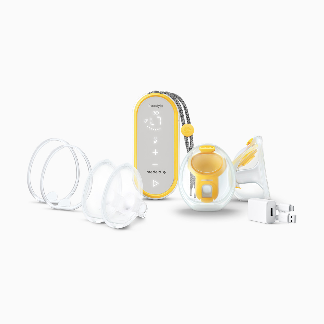 Medela Freestyle Hands-Free breast pump with separate motor unit collection cups and accessories