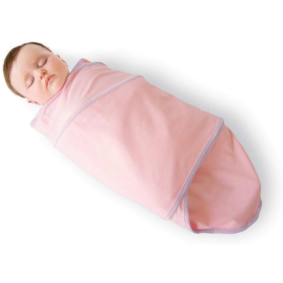 Miracle Blanket swaddling a sleeping baby in pink, the OG no-velcro tight wrap that NICU nurses use