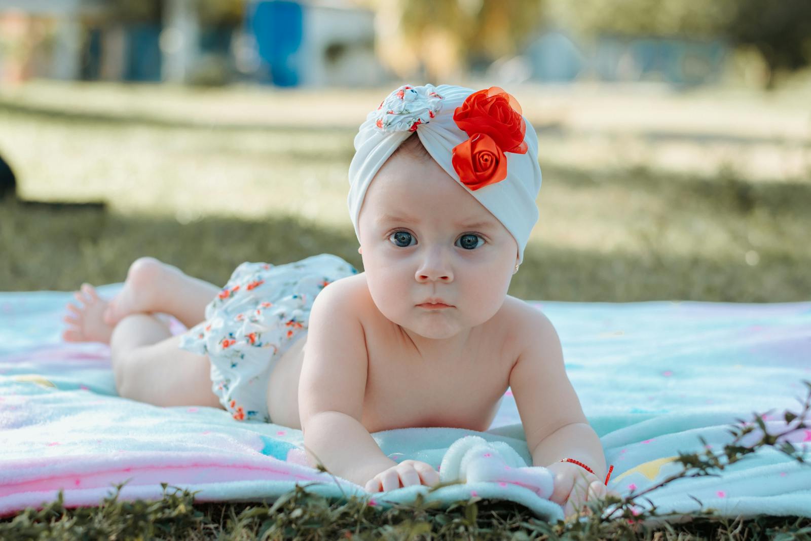 Adorable baby lying on a soft blanket between feeds