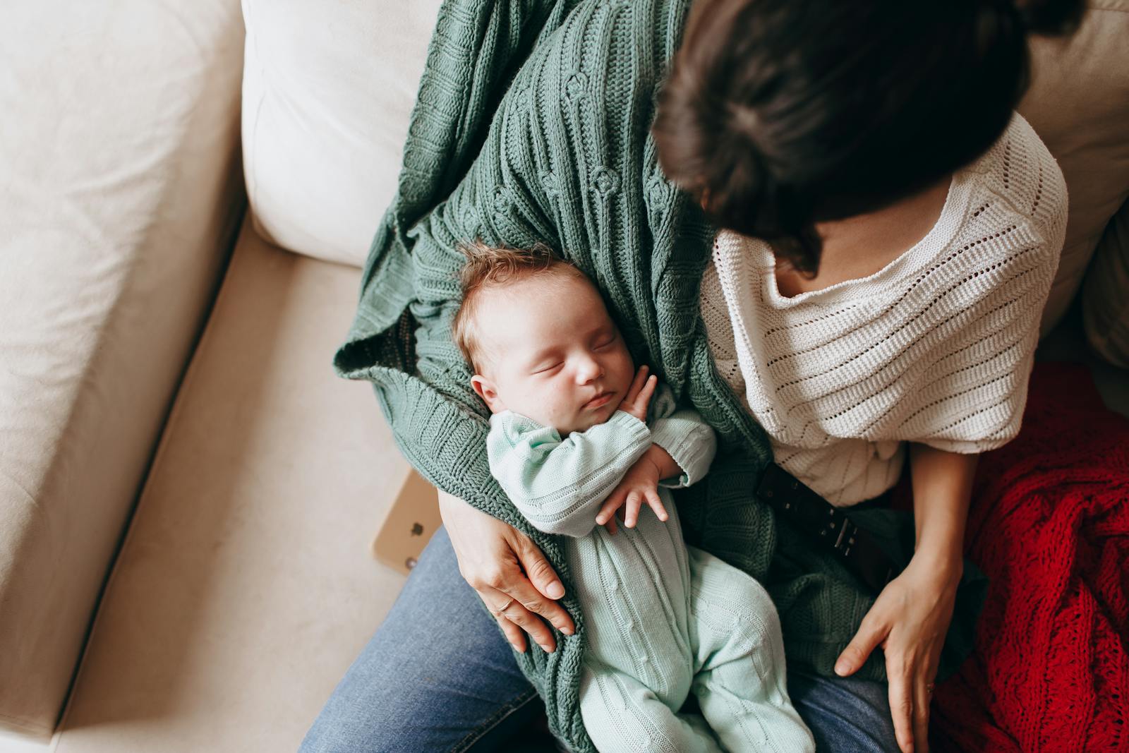 Postpartum mom resting at home with newborn